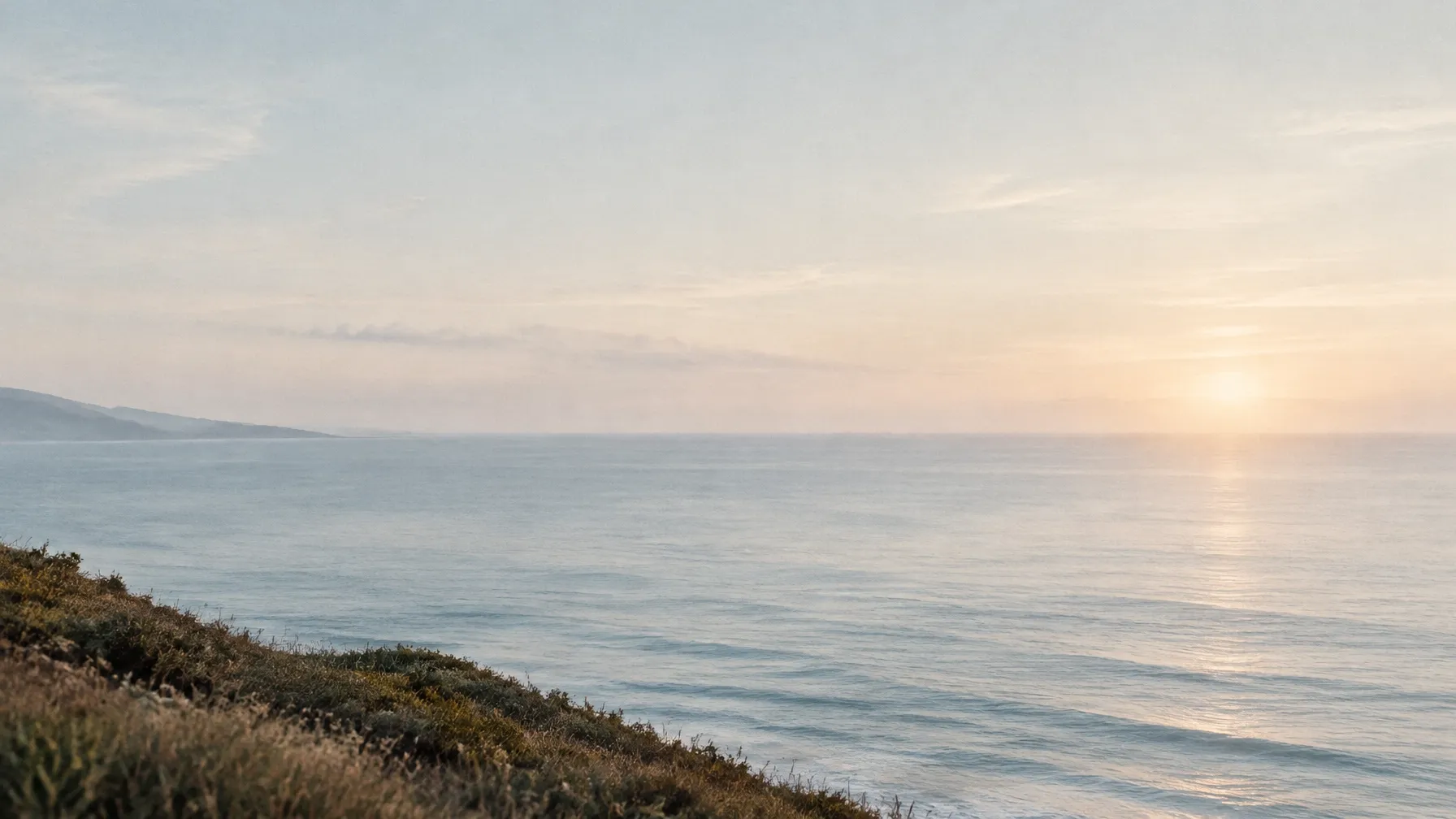 A calm ocean horizon at first light